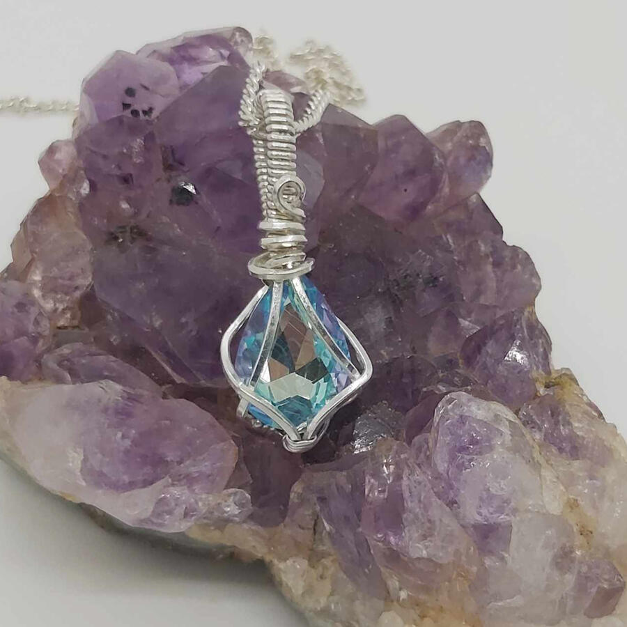 Faceted teardrop shaped "Aurora Crystal" (glass)
