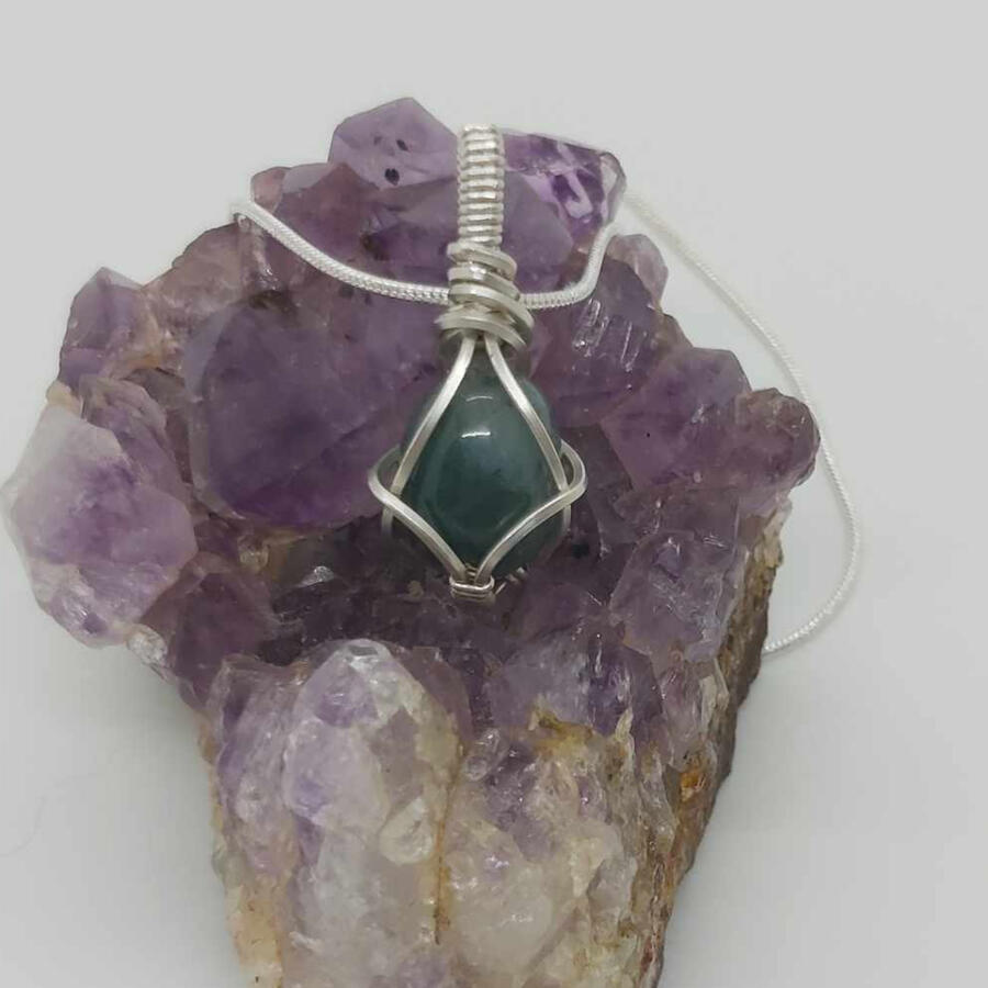 Oval shaped cabochon, green moss agate