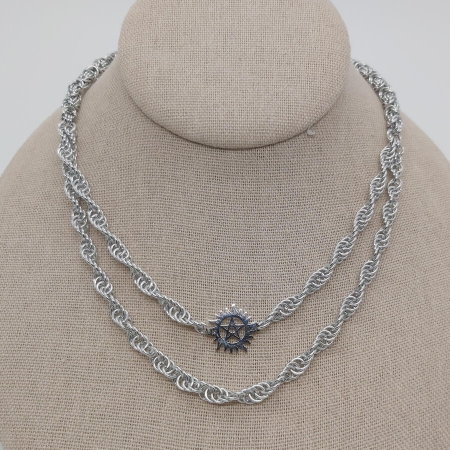 4-in-1 Spiral necklace. Gives the illusion of wearing two necklaces. Made with anodized aluminum rings.