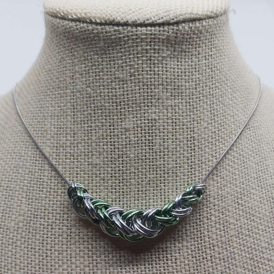 Slider necklace, made with anodized aluminum rings on a stainless steel chain.